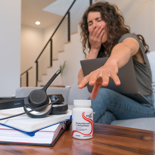A woman reaching for Methyl B12 with L-Methylfolate