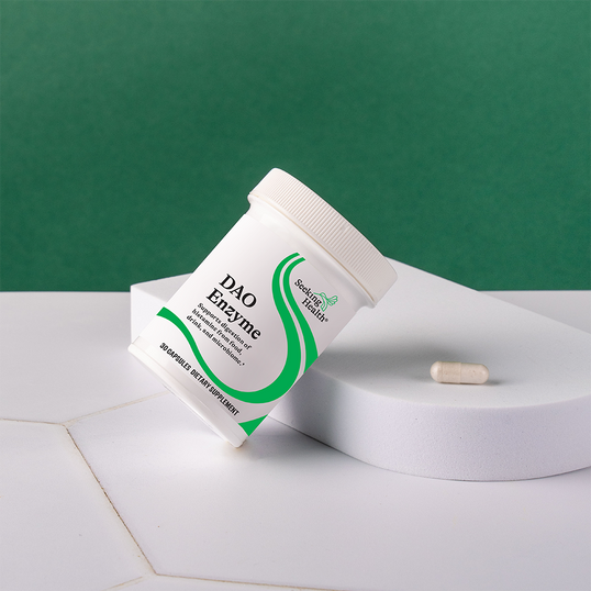 DAO Enzyme supplement container with a green label on a white surface against a green background