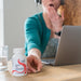 image of woman tired working at desk 