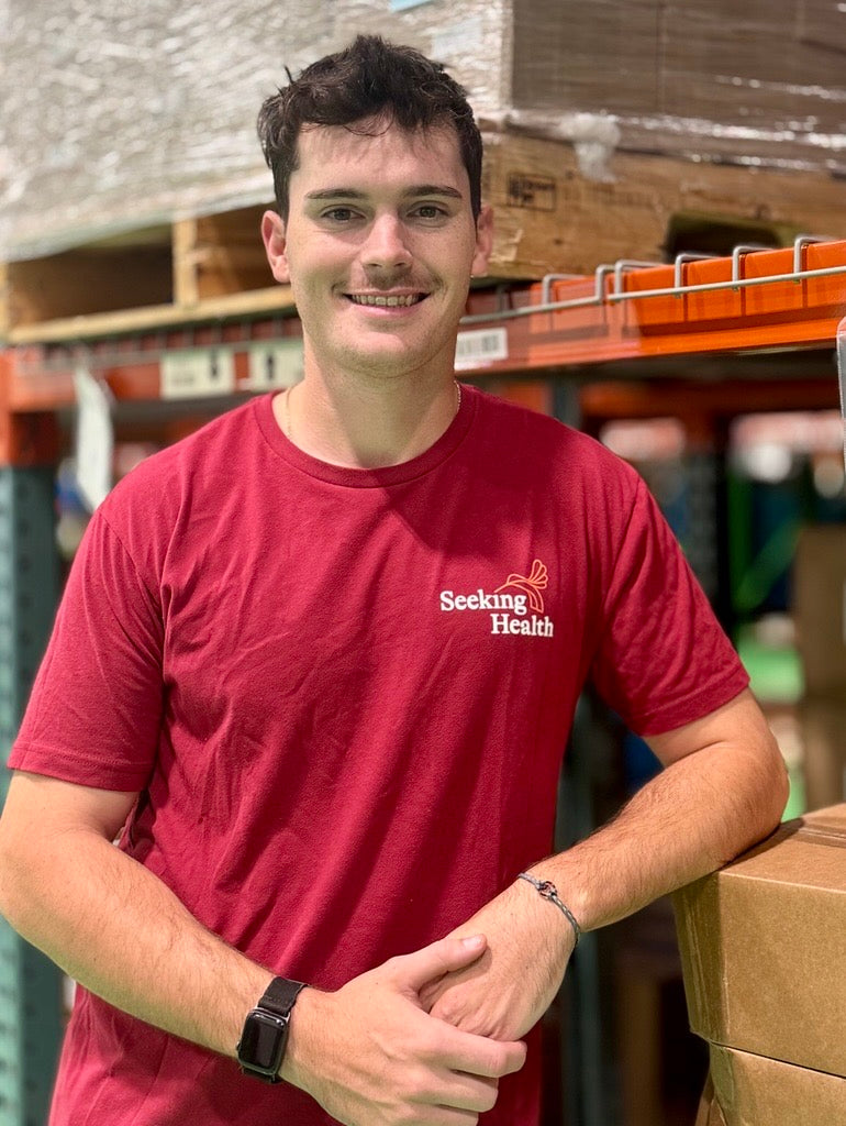 Young man in a red seeking health shirt 