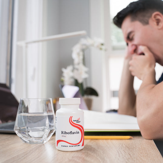 Man uses riboflavin supplement to support energy levels.