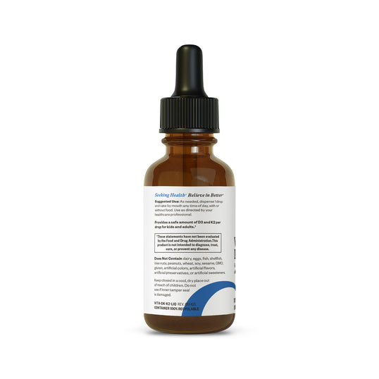 Brown glass bottle with dropper on a white background